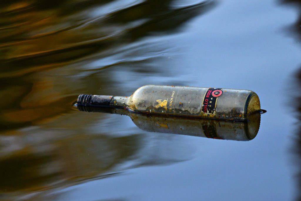 dirty bottle in water