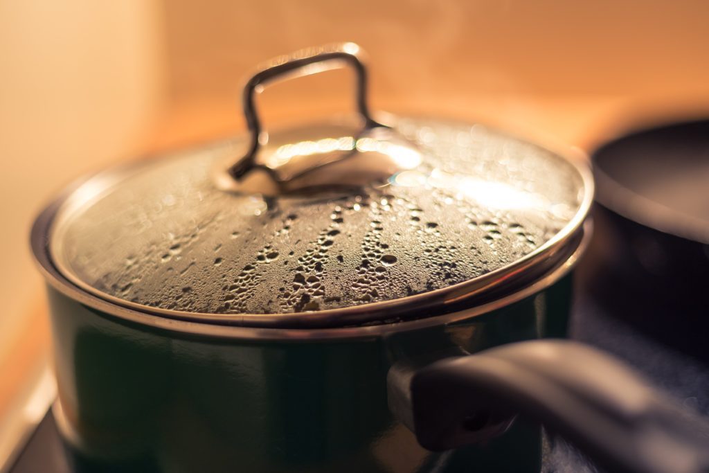 Pot boiling water on stove